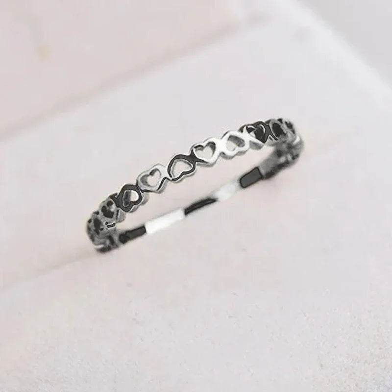 Jewelrieshub silver hollow heart finger ring with interconnected heart shapes design