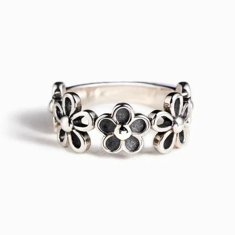 Cute adjustable flower ring with three silver floral designs by Jewelrieshub