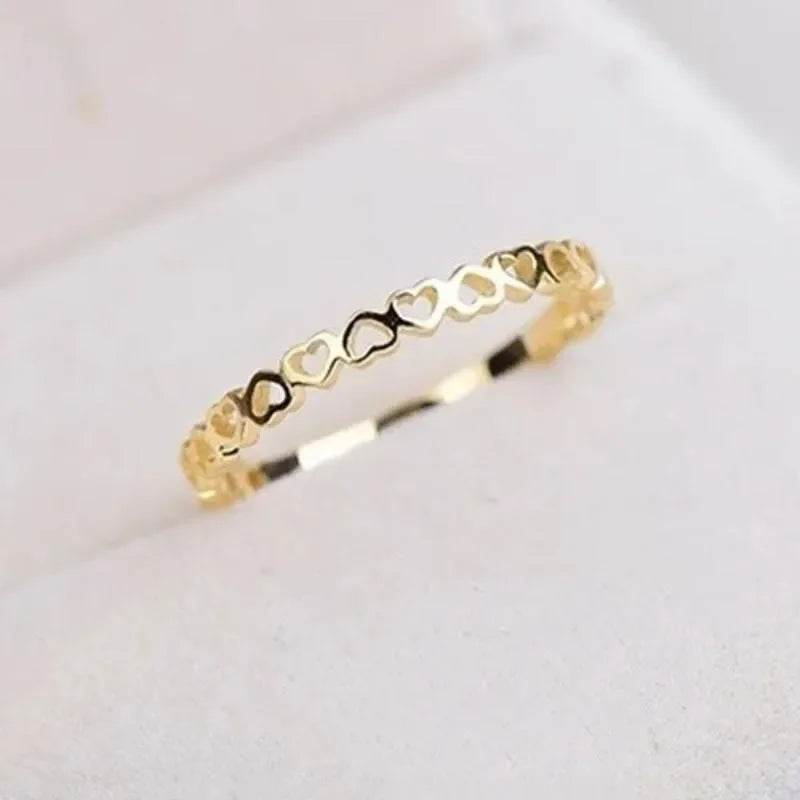 Jewelrieshub gold hollow heart finger ring with delicate heart-shaped cutouts
