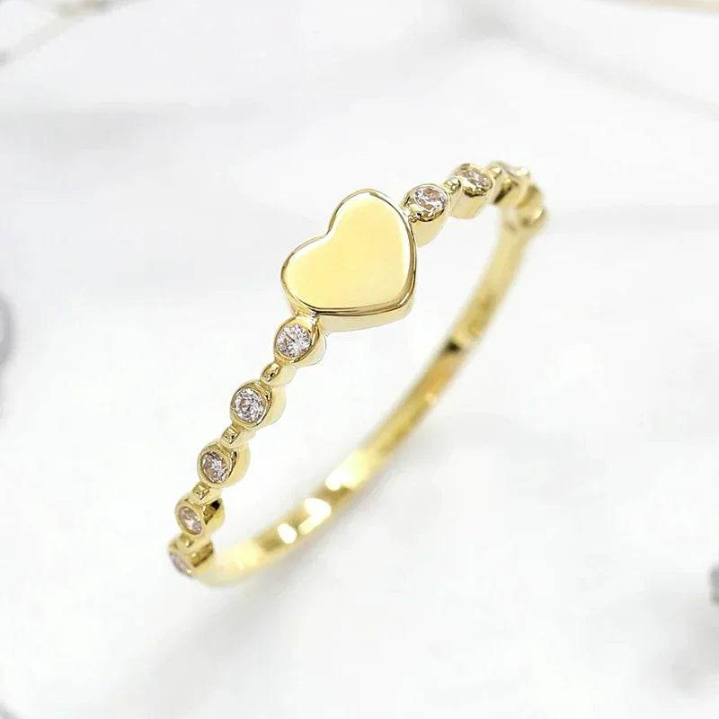 Jewelrieshub zirconia delicate finger ring featuring a gold band with heart and small sparkling stones