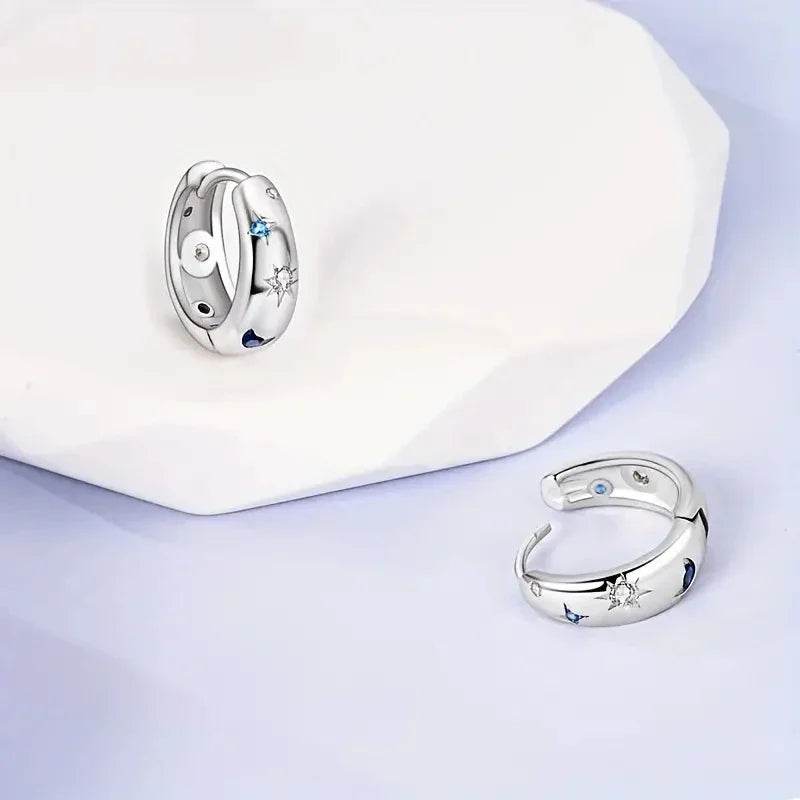 Jewelrieshub silver star moon circle earrings with blue and white gemstone accents on white and lavender background