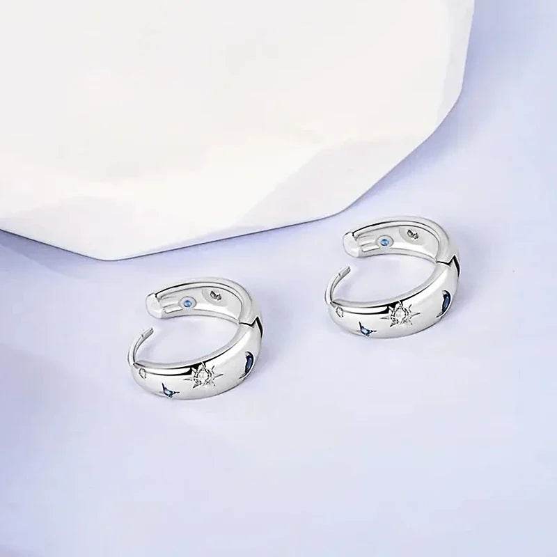 Jewelrieshub silver star moon circle earrings with celestial designs on a white surface