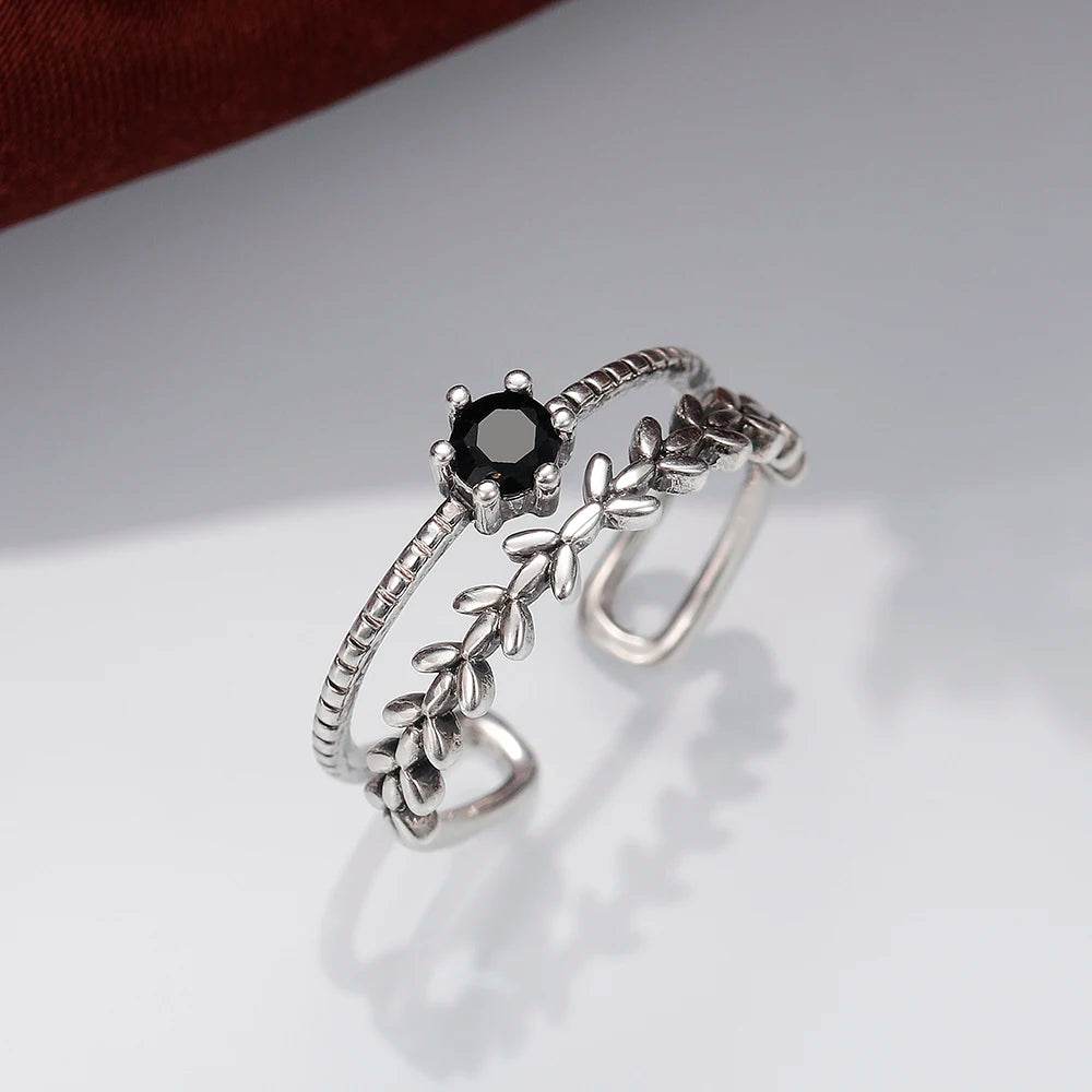 Jewelrieshub stylish ladies adjustable ring with black gemstone and leaf design in silver tone