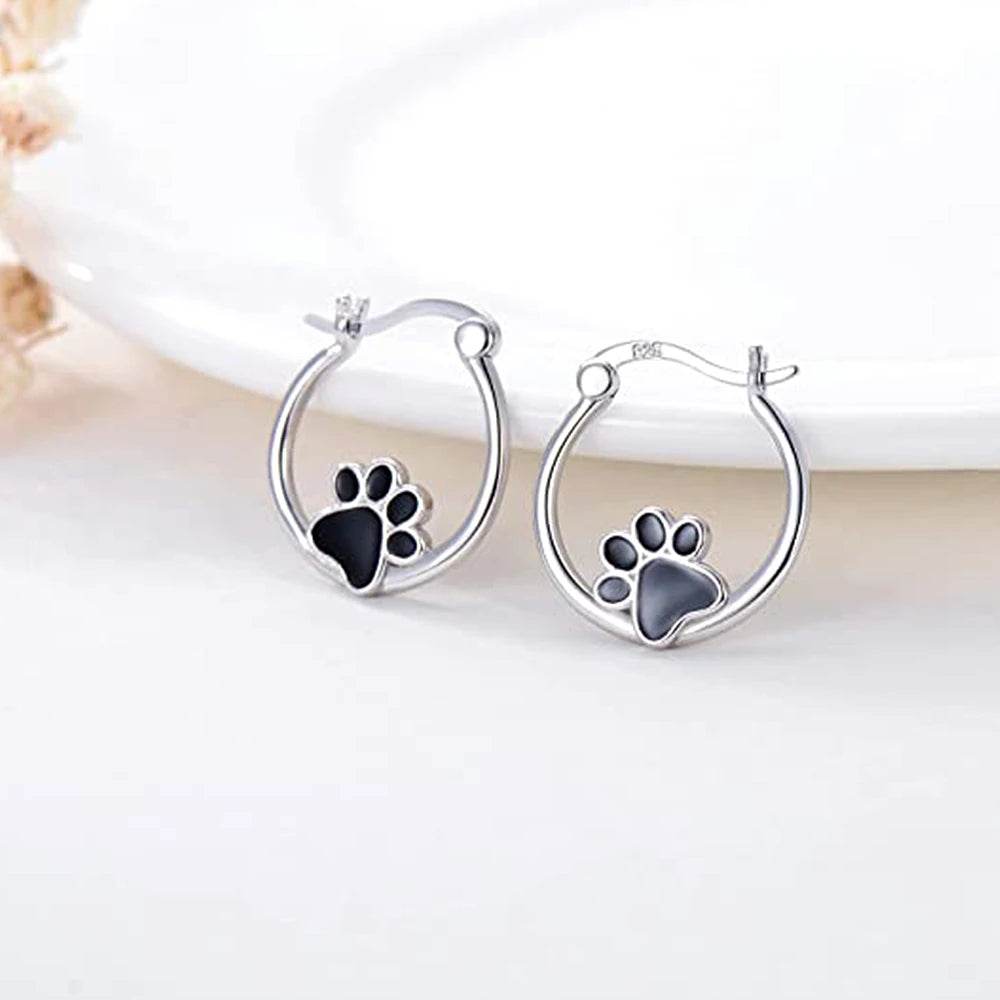 Silver cat claw hoop earrings with black paw design on small round hoops by Jewelrieshub