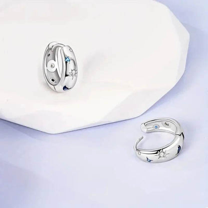Jewelrieshub silver star moon circle earrings with blue and white gemstone accents on white and lavender background